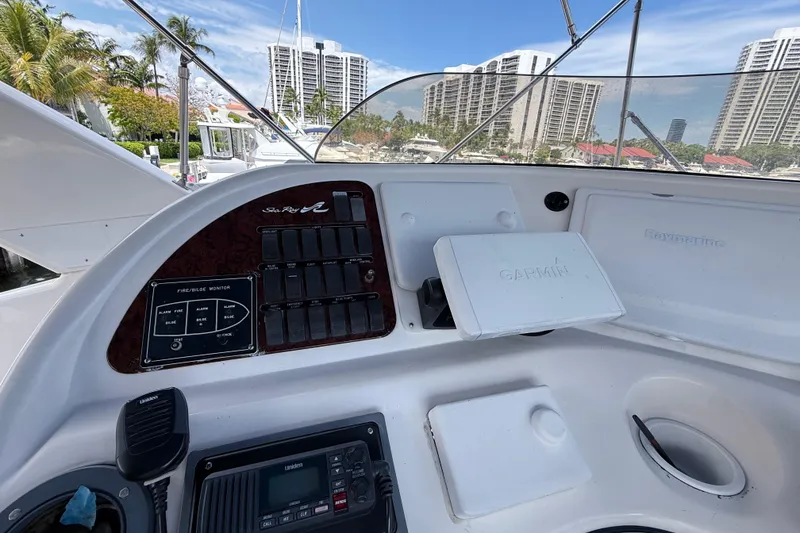 Slide: The Image of Control panel of a 2001 Sea Ray 450 Express Bridge yacht with Garmin and Raymarine equipment. - 9