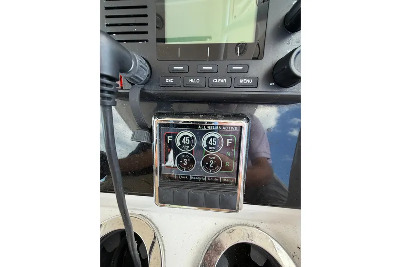 Slide: The Image of Control panel of a 2021 Fountain 38 CC LS boat, displaying RPM and navigation settings. - 19