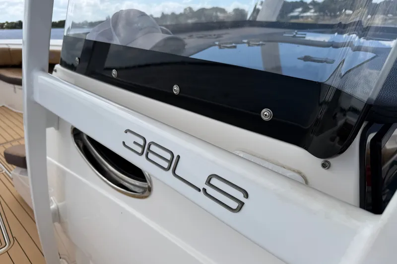Slide: The Image of 2021 Fountain 38 CC LS boat detail with logo and sleek design elements. - 20