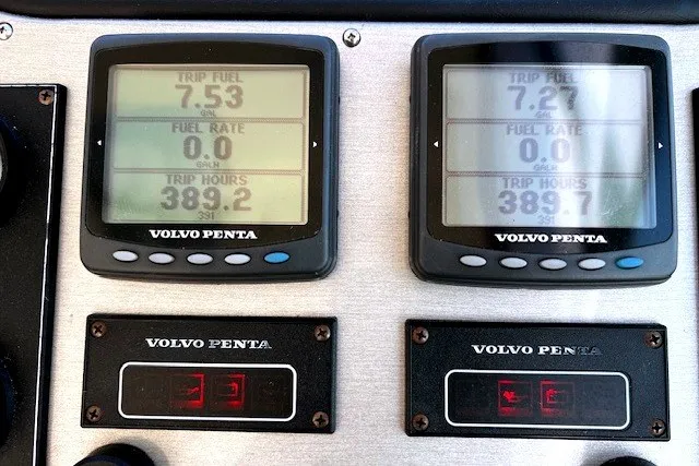 Slide: The Image of Dashboard of 2005 Cruisers Yachts 440 Express with Volvo Penta displays showing trip data. - 17