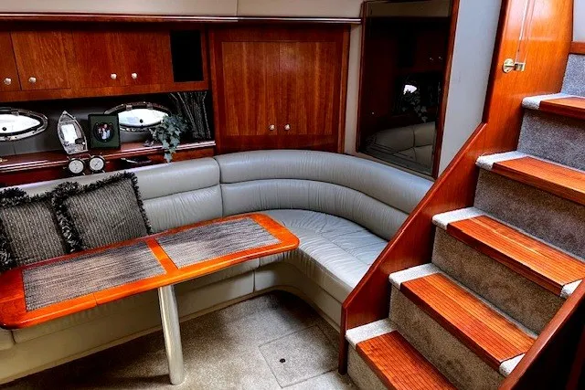 Slide: The Image of Luxurious 2005 Cruisers Yachts 440 Express interior with elegant wood and leather seating. - 5