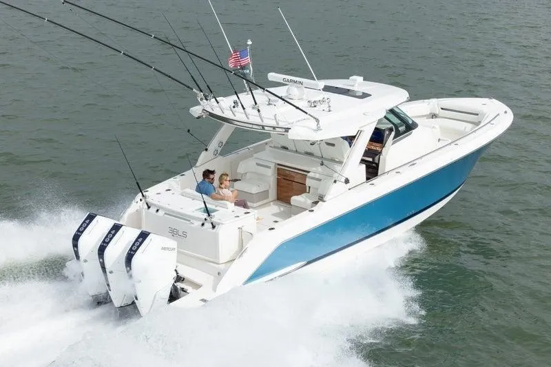 The Image of 2025 Tiara Sport 38 LS boat cruising on water with dual outboard engines. - 0
