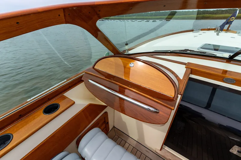 Slide: The Image of 2007 Hinckley Talaria 29R boat interior with polished wood and leather seating. - 7