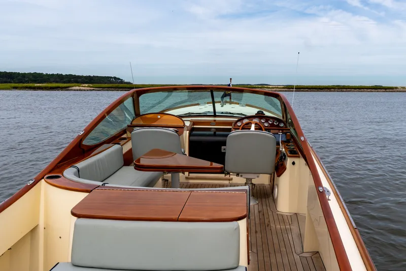 Slide: The Image of 2007 Hinckley Talaria 29R boat interior with elegant wood and leather seating. - 12
