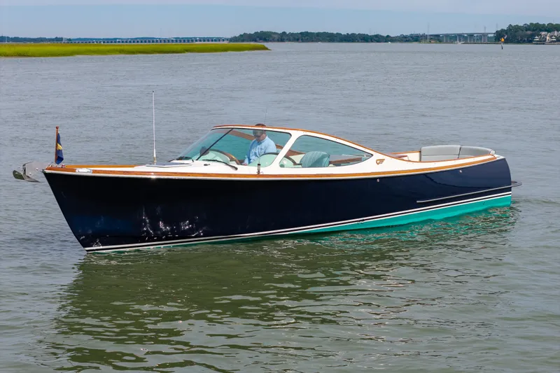 The Image of 2007 Hinckley Talaria 29R cruising on calm waters, showcasing elegant design and craftsmanship. - 1