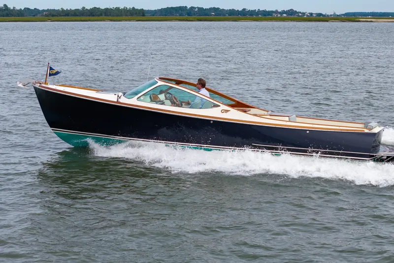 Slide: The Image of 2007 Hinckley Talaria 29R cruising on open water, showcasing sleek design and performance. - 25