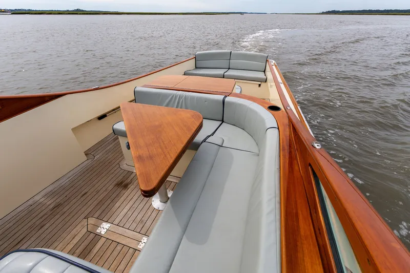 Slide: The Image of Luxurious 2007 Hinckley Talaria 29R boat with elegant wood and leather seating on open water. - 9