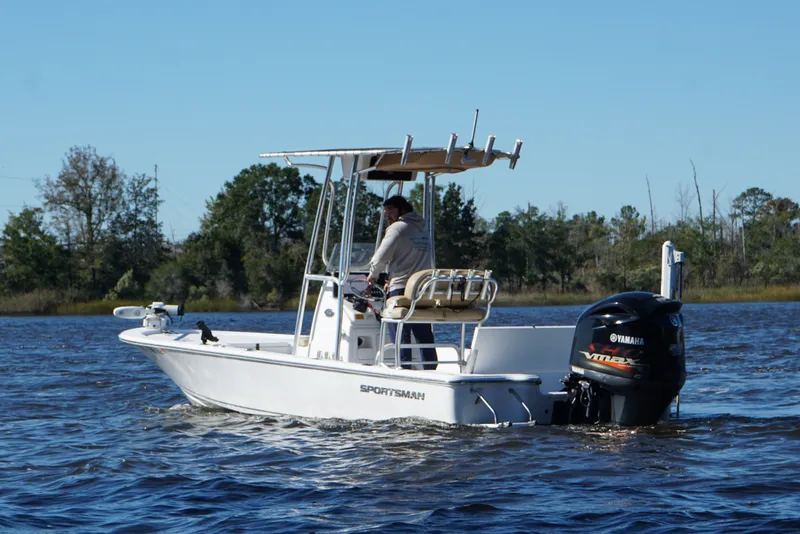 Slide: The Image of 2017 Sportsman Tournament 214 Bay Boat cruising on a calm lake. - 4