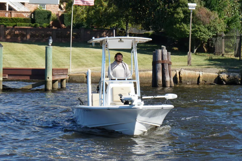Slide: The Image of 2017 Sportsman Tournament 214 Bay Boat navigating a scenic waterway. - 21
