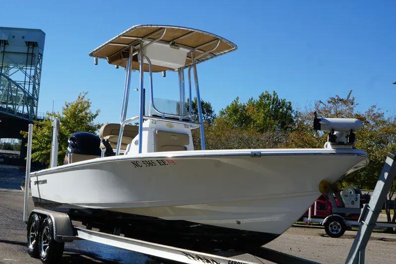 Slide: The Image of 2017 Sportsman Tournament 214 Bay Boat on trailer, under clear blue sky. - 8