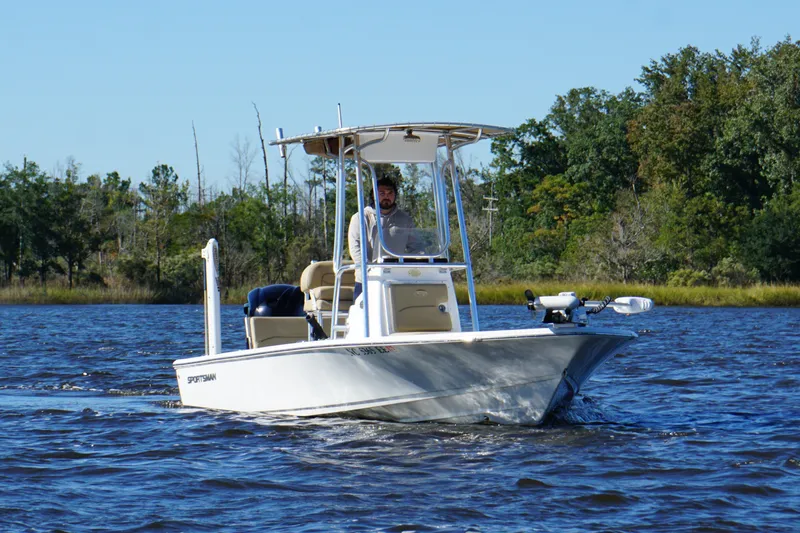 Slide: The Image of 2017 Sportsman Tournament 214 Bay Boat cruising on a scenic river. - 25