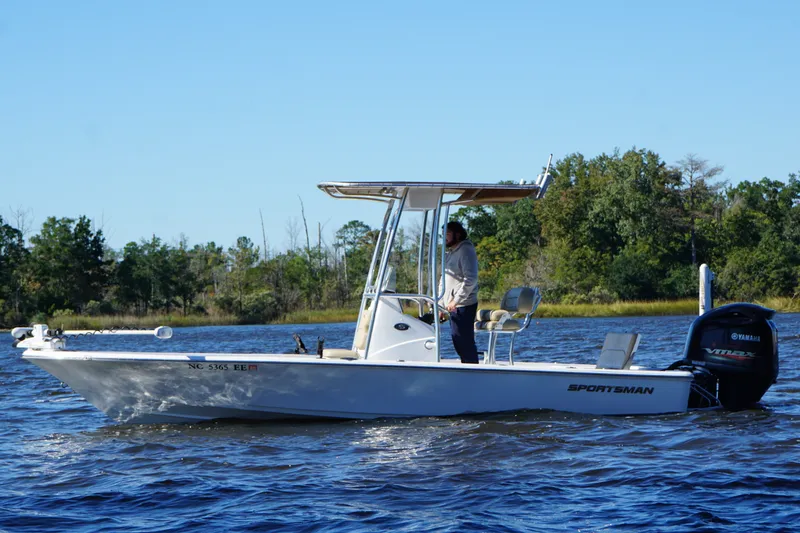 Slide: The Image of 2017 Sportsman Tournament 214 Bay Boat cruising on a scenic lake. - 22