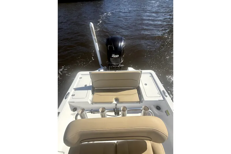 Slide: The Image of 2017 Sportsman Tournament 214 Bay Boat with outboard motor on water. - 16