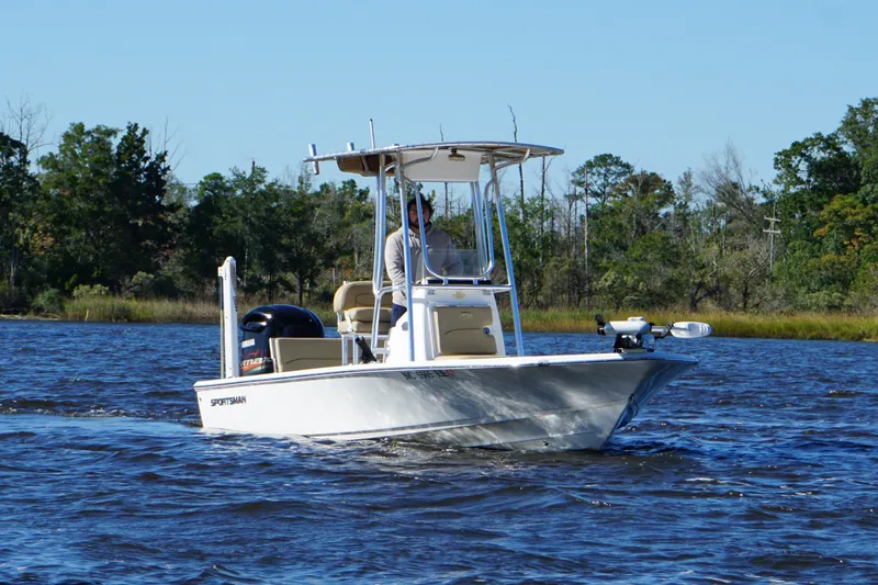 Slide: The Image of 2017 Sportsman Tournament 214 Bay Boat cruising on a scenic waterway. - 10
