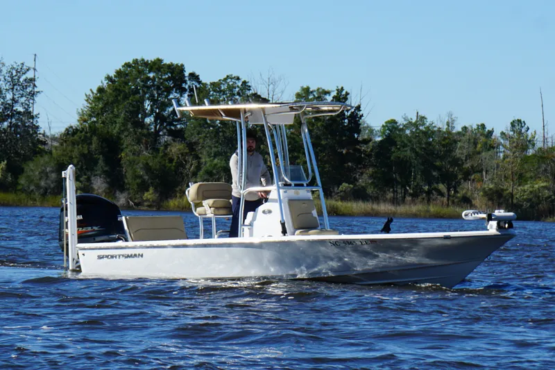 Slide: The Image of 2017 Sportsman Tournament 214 Bay Boat cruising on a scenic river. - 9