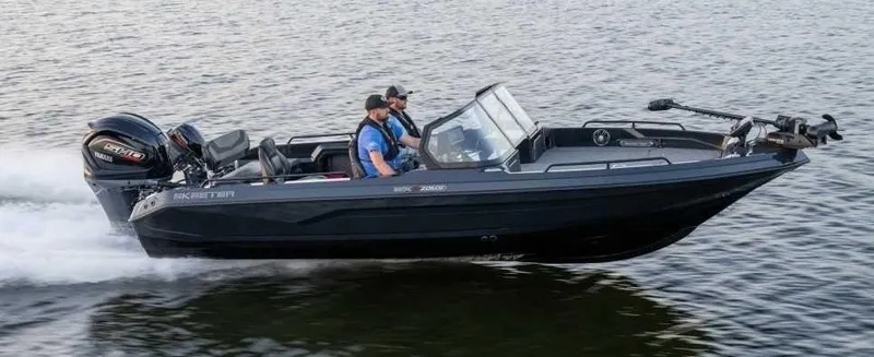 The Image of Two people ride in a black Skeeter WX2060 F boat on calm water. - 1