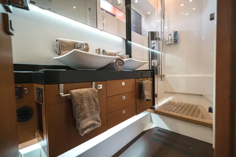 Slide: The Image of Luxurious bathroom in 2014 Prestige 620 yacht with dual sinks and modern shower. - 41