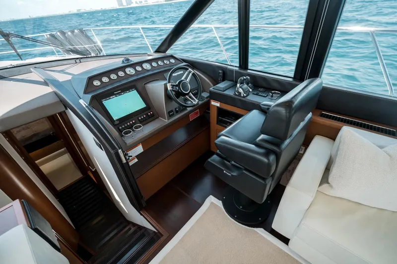 Slide: The Image of Luxurious helm of 2014 Prestige 620 yacht with modern controls and ocean view. - 31