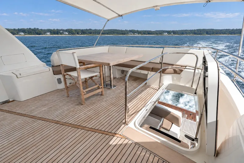 Slide: The Image of Luxurious 2014 Prestige 620 yacht deck with seating and ocean view. - 11