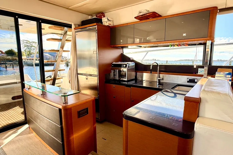 Slide: The Image of Luxurious kitchen interior of a 2014 Prestige 620 yacht with modern appliances and scenic views. - 20