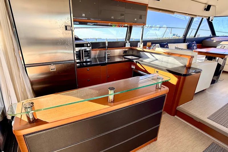 Slide: The Image of Luxurious interior of a 2014 Prestige 620 yacht with modern kitchen amenities. - 22