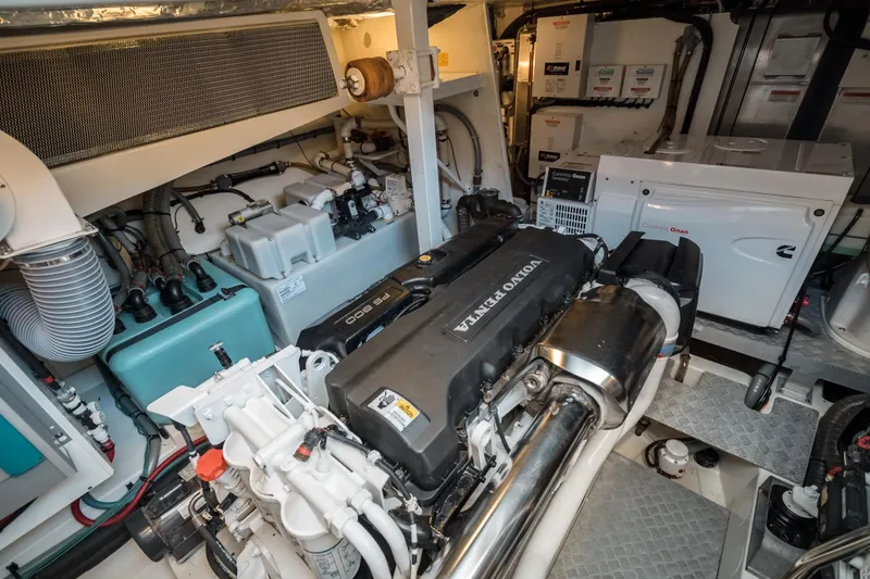 Slide: The Image of Engine room of a 2014 Prestige 620 yacht featuring a Volvo Penta engine. - 56