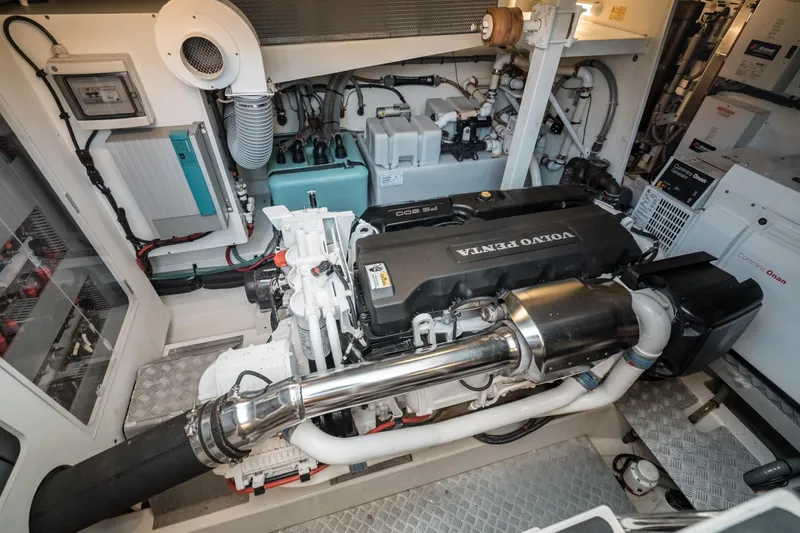 Slide: The Image of Engine room of a 2014 Prestige 620 yacht featuring a Volvo Penta engine. - 55