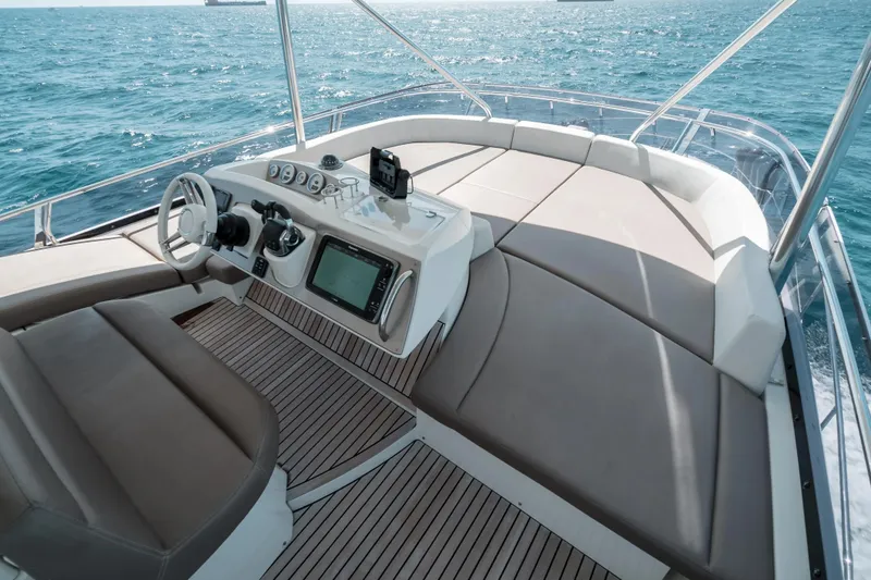 Slide: The Image of Luxurious 2014 Prestige 620 yacht helm with ocean view and modern navigation equipment. - 15