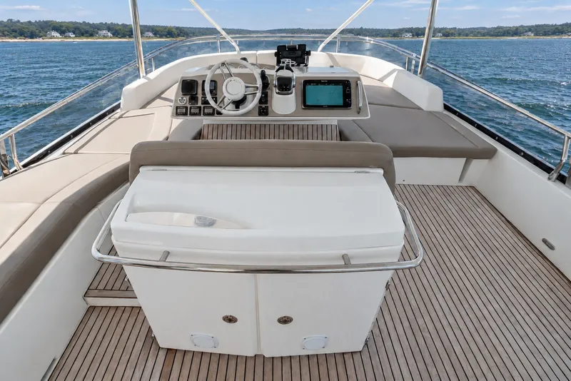 Slide: The Image of Flybridge of 2014 Prestige 620 yacht with helm, seating, and ocean view. - 12
