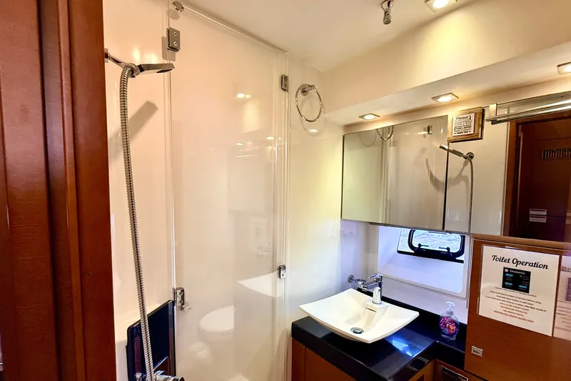 Slide: The Image of Luxurious bathroom in 2014 Prestige 620 yacht with modern fixtures and elegant design. - 49
