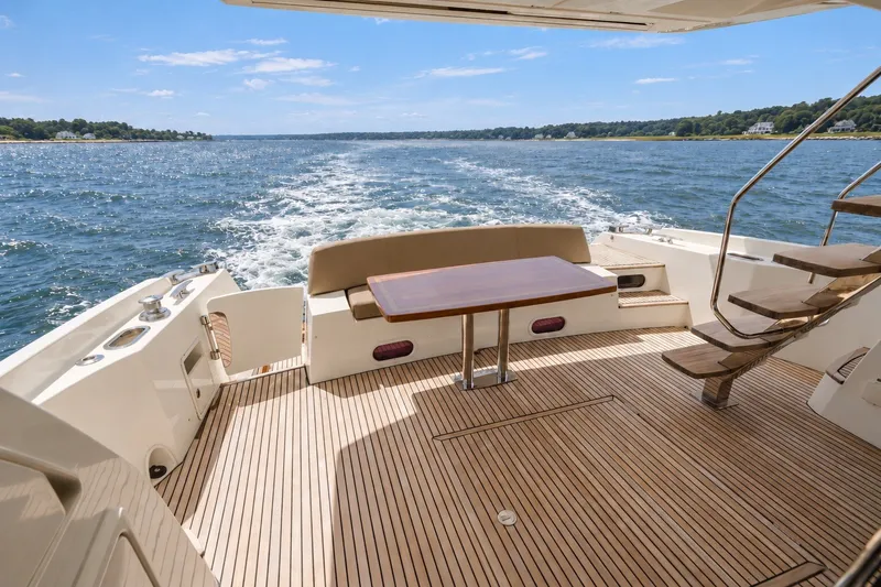 Slide: The Image of Luxurious 2014 Prestige 620 yacht deck with ocean view and elegant seating area. - 6
