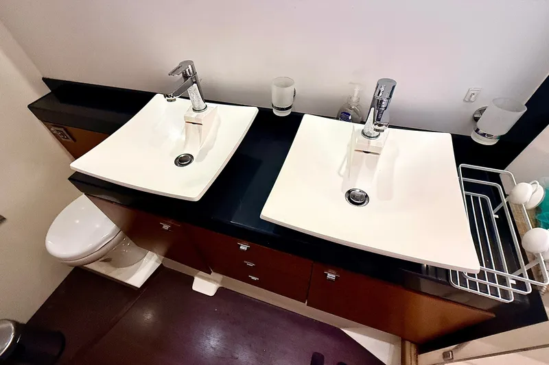 Slide: The Image of Modern bathroom with dual sinks and sleek fixtures on a Prestige 620 yacht, 2014 model. - 42