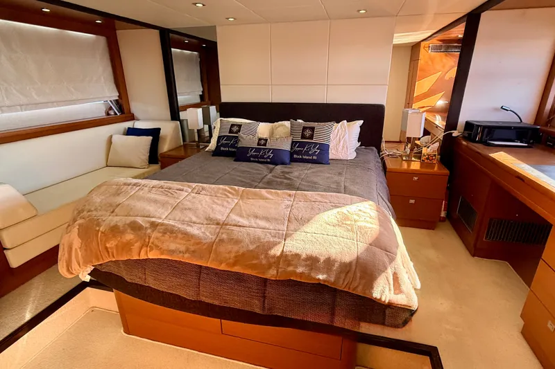 Slide: The Image of Luxurious bedroom interior of 2014 Prestige 620 yacht with cozy bedding and elegant decor. - 36