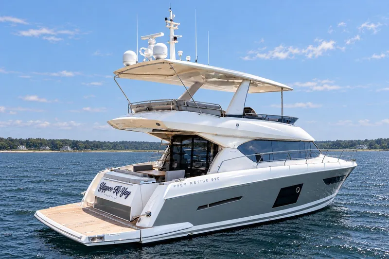 The Image of Luxury 2014 Prestige 620 yacht cruising on a sunny day, featuring sleek design and spacious deck. - 0
