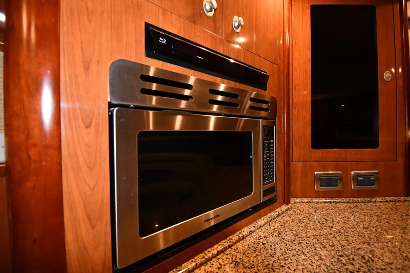 Slide: The Image of Luxury kitchen interior of 2005 Sea Ray 420 Sundancer yacht with stainless steel appliances. - 33