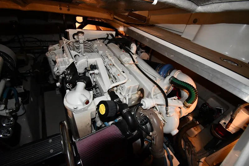 Slide: The Image of Engine room of 2005 Sea Ray 420 Sundancer, showcasing detailed mechanical components. - 49