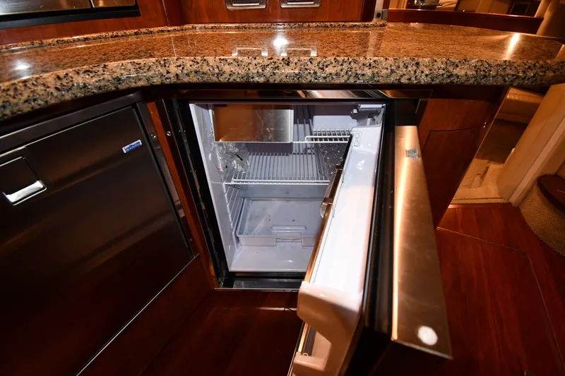 Slide: The Image of Open refrigerator in 2005 Sea Ray 420 Sundancer yacht kitchen with granite countertop. - 35