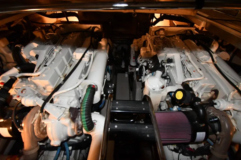 Slide: The Image of Engine room of 2005 Sea Ray 420 Sundancer with dual engines and mechanical components. - 45