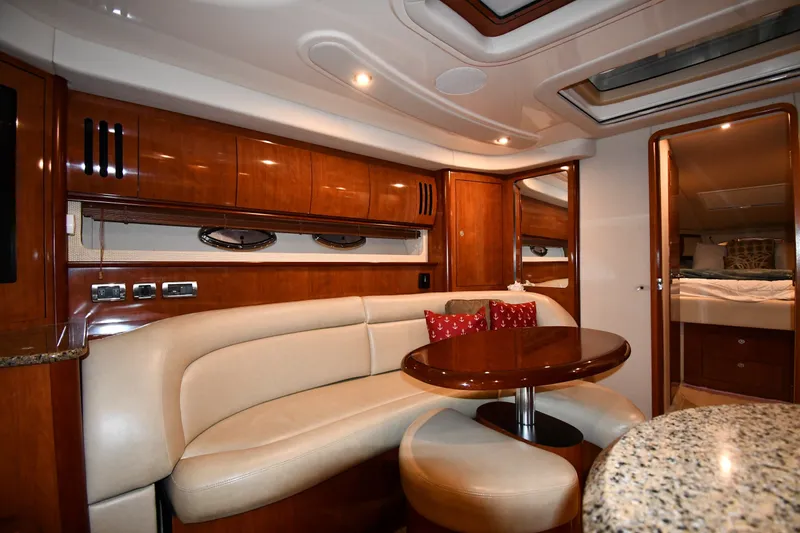 Slide: The Image of Luxurious interior of 2005 Sea Ray 420 Sundancer yacht with elegant wood finishes and plush seating. - 29