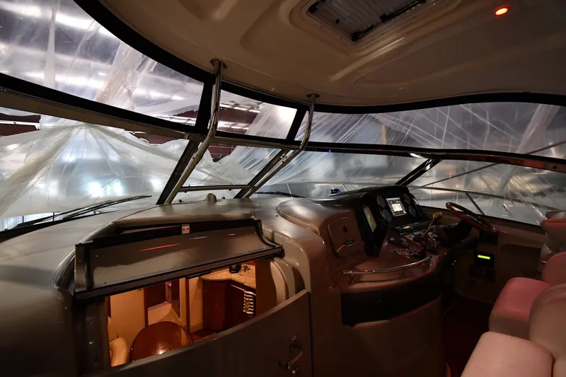 Slide: The Image of Interior view of 2005 Sea Ray 420 Sundancer yacht cockpit with navigation controls. - 6