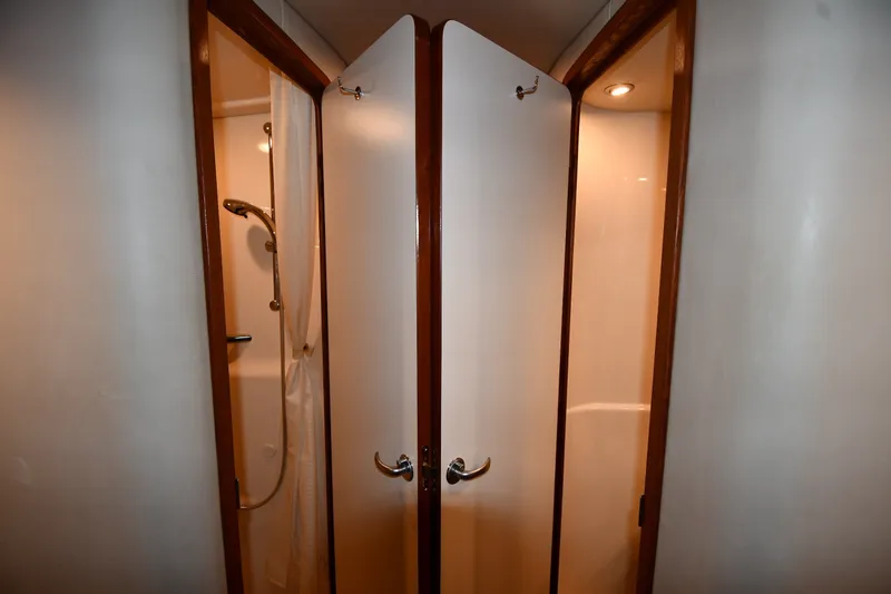 Slide: The Image of Shower area inside 2005 Sea Ray 420 Sundancer yacht with wooden trim and lighting. - 25