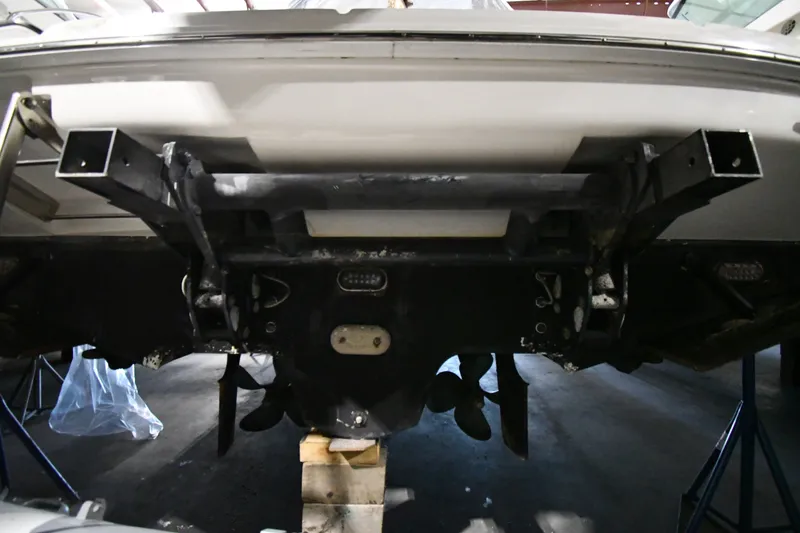 Slide: The Image of 2005 Sea Ray 420 Sundancer boat underside in a storage facility. - 54