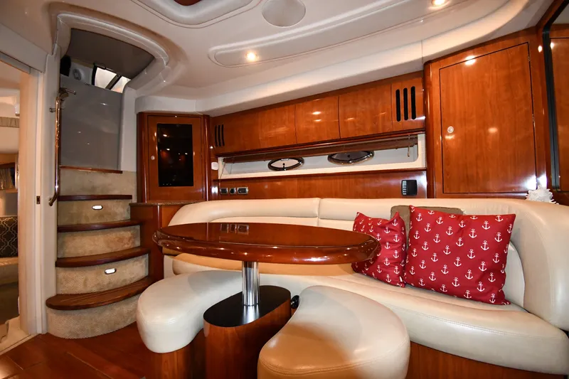 Slide: The Image of Luxurious 2005 Sea Ray 420 Sundancer yacht interior with elegant wood finishes and plush seating. - 30