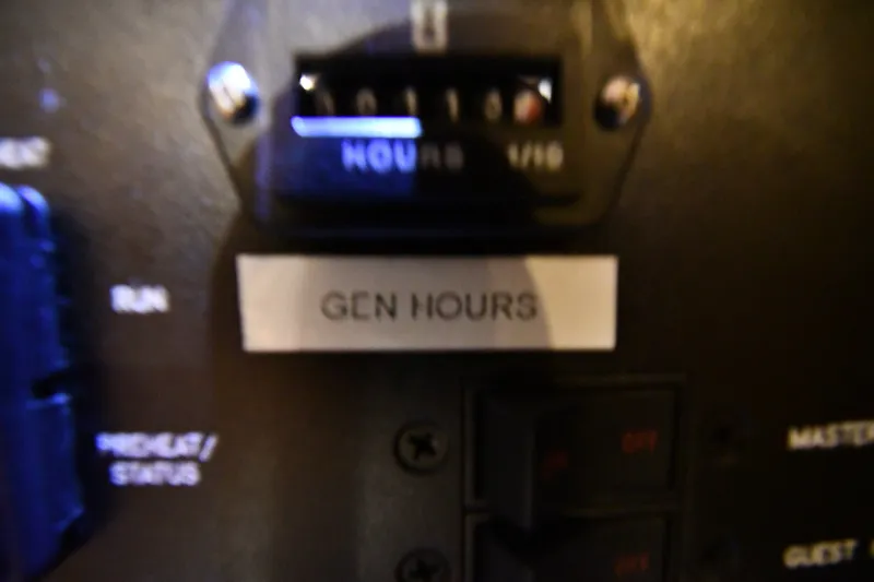 Slide: The Image of Close-up of generator hours meter on 2005 Sea Ray 420 Sundancer boat. - 43