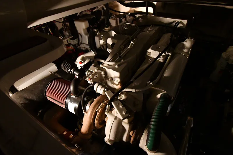 Slide: The Image of Engine compartment of a 2005 Sea Ray 420 Sundancer boat, showcasing mechanical components. - 46