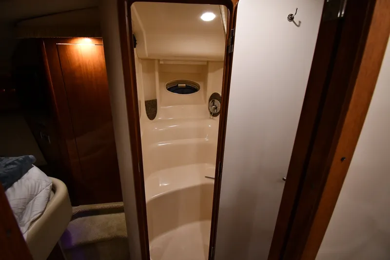 Slide: The Image of Interior of 2005 Sea Ray 420 Sundancer yacht, featuring a compact bathroom. - 27