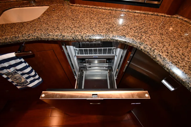 Slide: The Image of Open dishwasher in 2005 Sea Ray 420 Sundancer yacht kitchen with granite countertop. - 36
