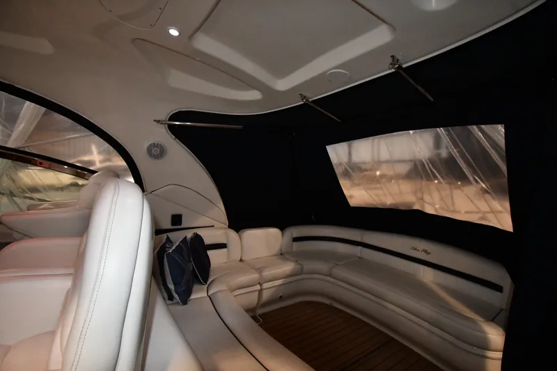 Slide: The Image of Interior of 2005 Sea Ray 420 Sundancer yacht with white leather seating and wood flooring. - 15
