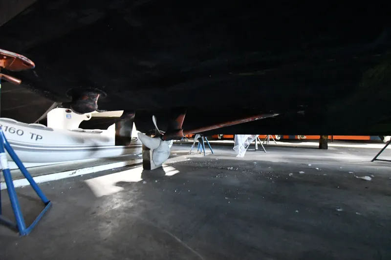 Slide: The Image of Underneath view of a 2005 Sea Ray 420 Sundancer boat in dry dock. - 53