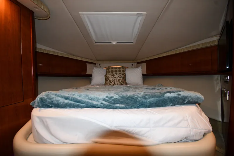 Slide: The Image of Luxurious cabin interior of 2005 Sea Ray 420 Sundancer yacht with cozy bedding. - 20